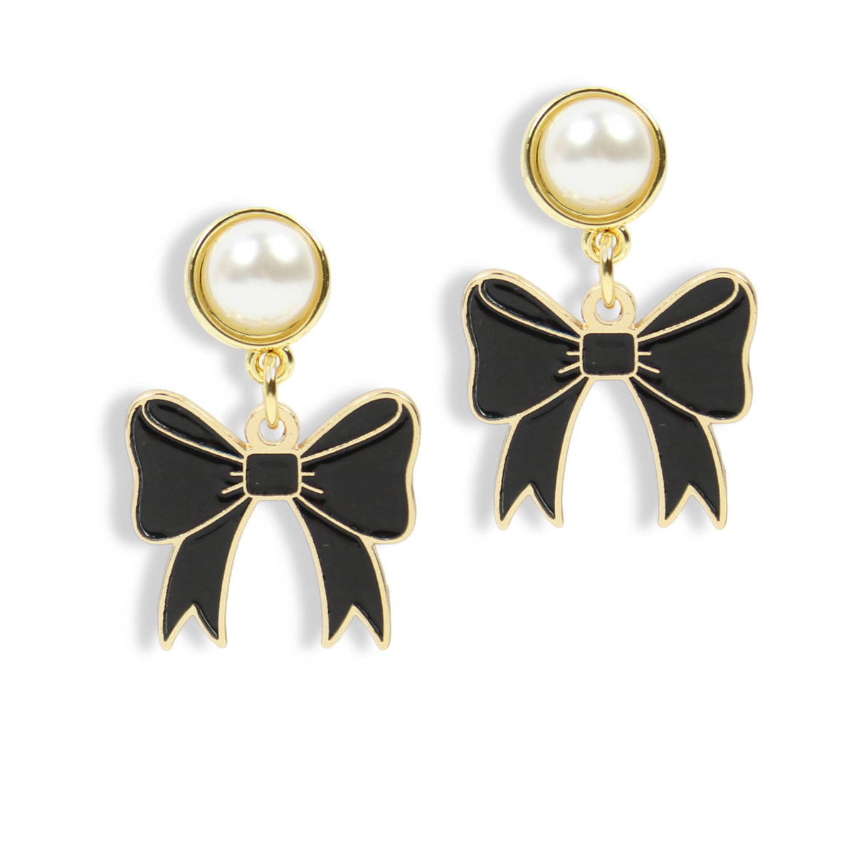 A pair of gold-tone drop earrings featuring a round white faux-pearl stud at the top and a dangling bow-shaped charm with black enamel and gold-tone outlines, shown on a plain white background.