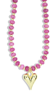 Pink beaded necklace with gold accents and gold heart pendant