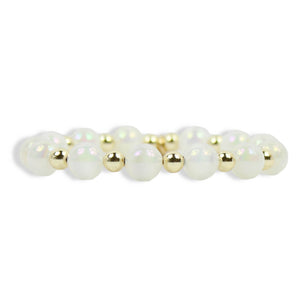 Annie Opal Stretch Bracelet with iridescent white opal-style beads, polished gold spacer beads, and signature gold tag by Bourbon and Boweties