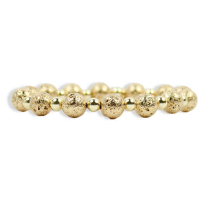 Annie Gold Lava Stretch Bracelet featuring textured gold lava beads, polished gold spacer beads, and signature gold tag by Bourbon and Boweties