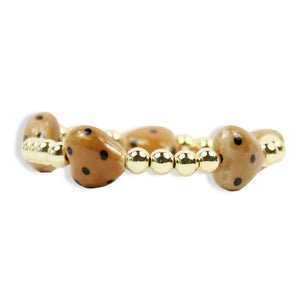 Annie Honey Heart Stretch Bracelet with honey-colored heart-shaped beads, black speckled details, polished gold spacer beads, and signature gold tag by Bourbon and Boweties