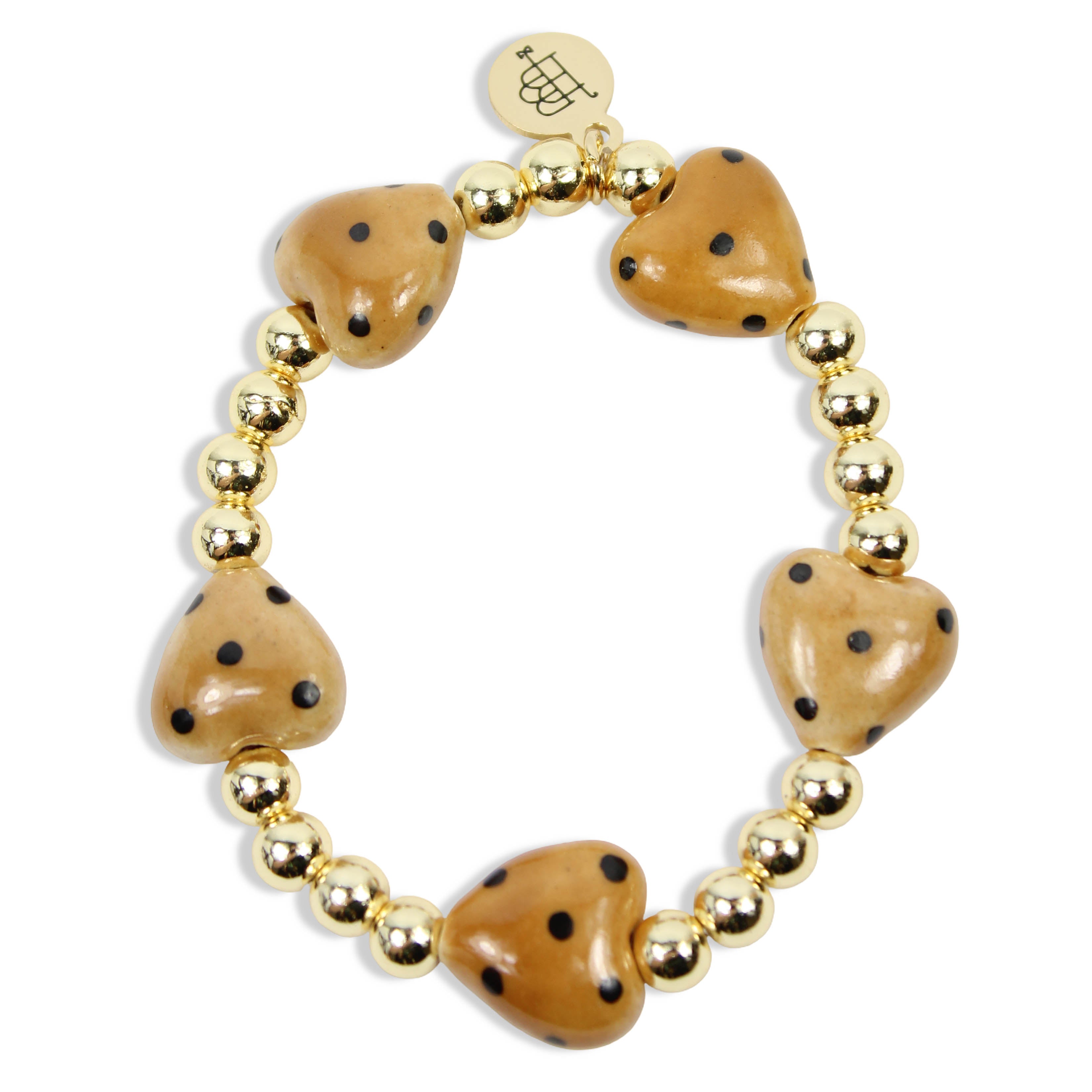 Annie Honey Heart Stretch Bracelet with honey-colored heart-shaped beads, black speckled details, polished gold spacer beads, and signature gold tag by Bourbon and Boweties